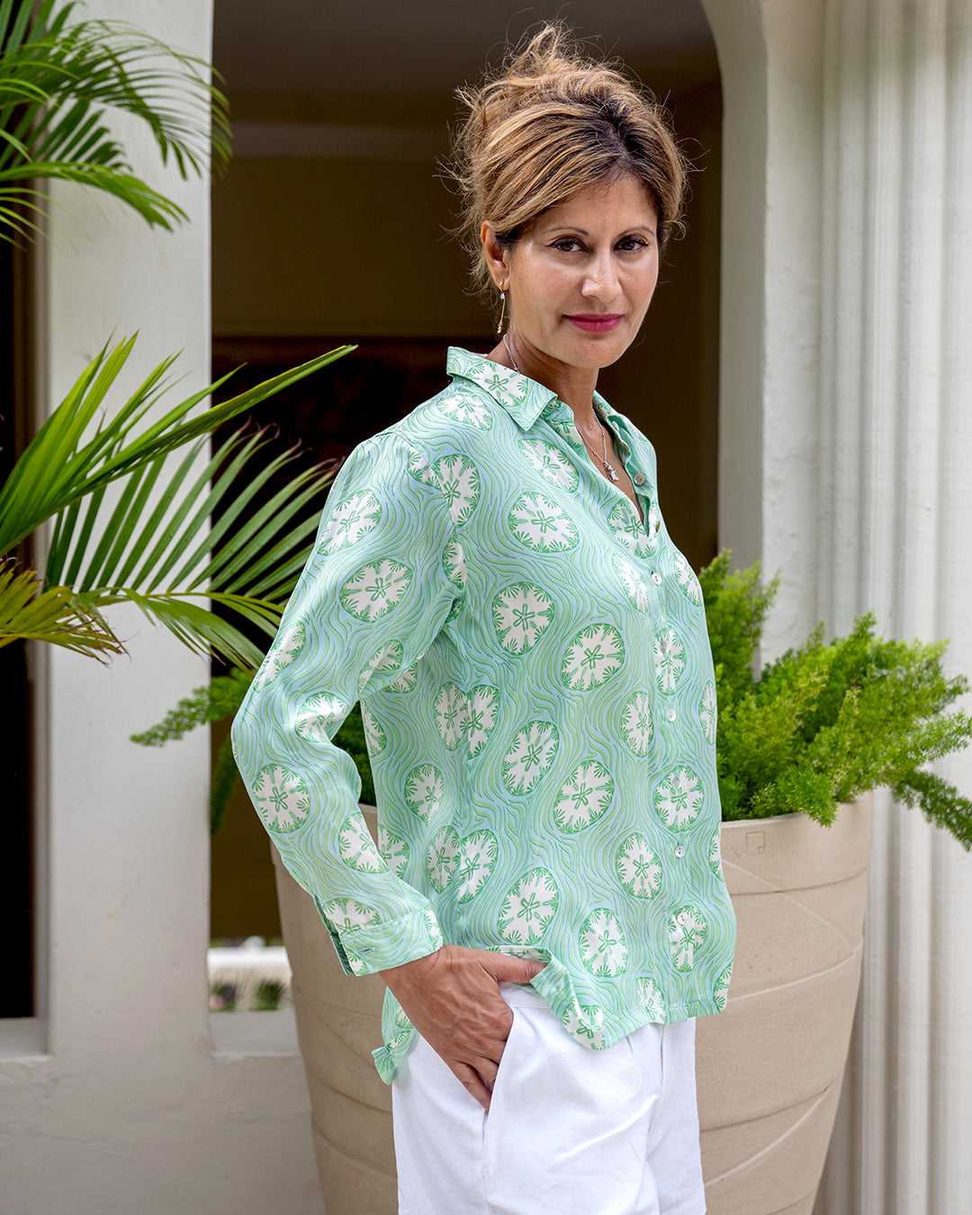 Elegant villa vacation style silk shirt in green sand dollar print by resortwear designer Lotty B Mustique