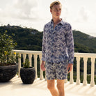 Sustainable vacation wear mens swim shorts in navy blue floral Protea print