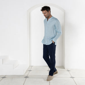 Casual linen trousers worn with pale blue linen shirt