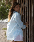 Chic beach vacation style linen shirt cover up in pretty blue Sealeaf pattern