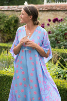 Summer wedding party silk kaftan in Lime Slice blue & pink print by Lotty B Mustique