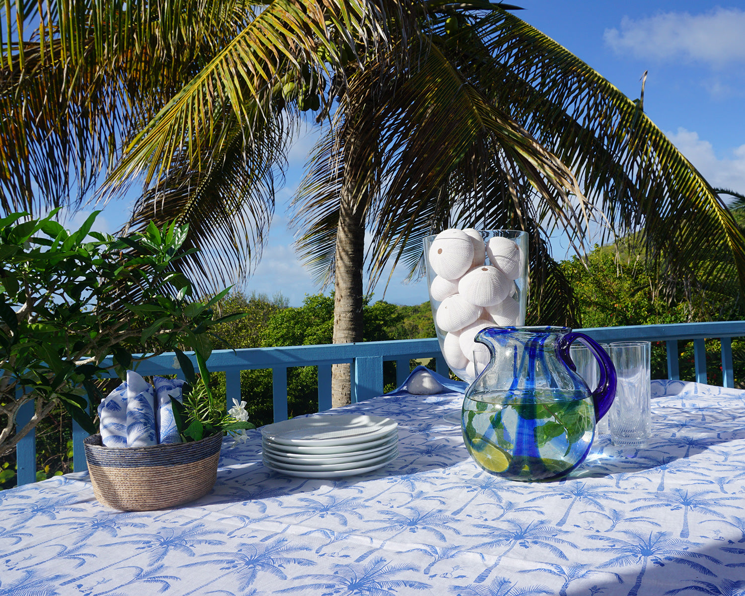 Tropical garden style tablecloth set with 8 matching napkins in white & blue plantation palms and coconuts print designer Lotty B Mustique